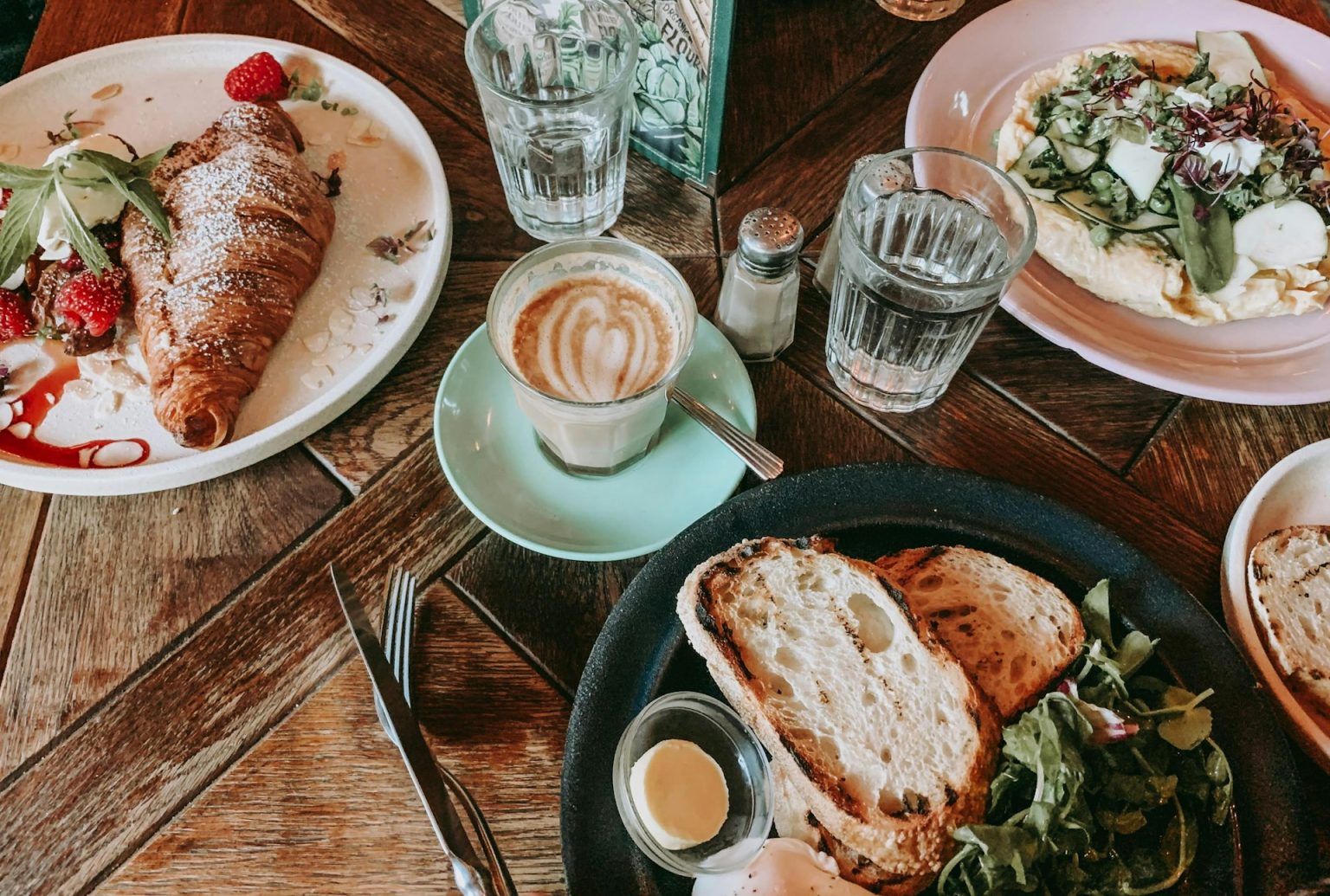 Brunch spread with coffee on a wooden table