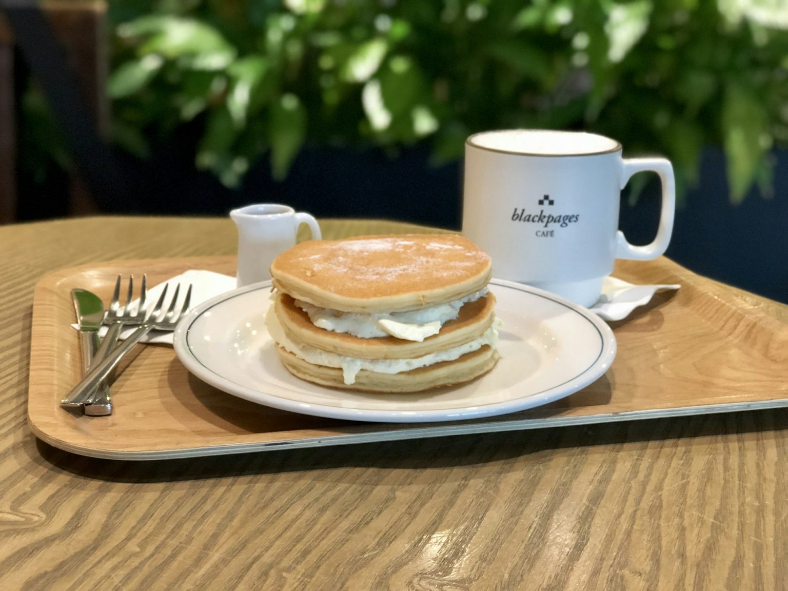 Stack of pancakes with a mug of coffee